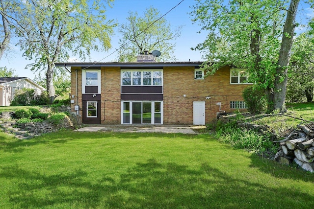 2747 Perry Rd, Flossmoor, IL 60422 - back of property featuring a lawn, a patio, brick siding, and a chimney