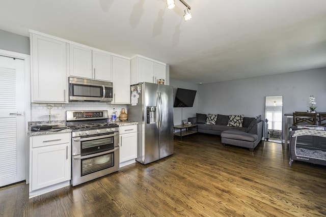 19451 W Hoag Ct, Mundelein, IL 60060 - kitchen featuring appliances with stainless steel finishes, dark wood-style floors, open floor plan, backsplash, and white cabinets