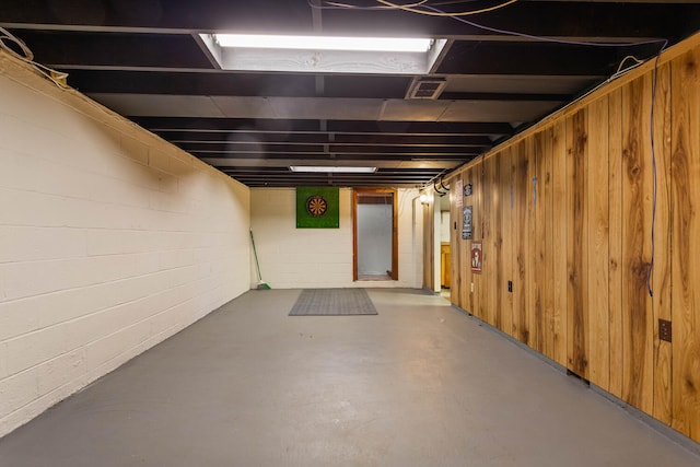 finished basement with concrete block wall
