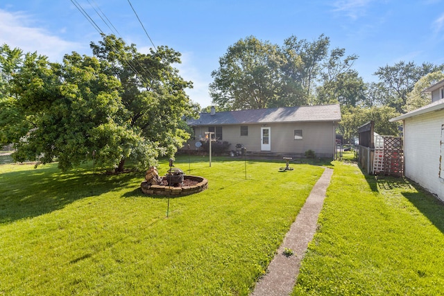 view of yard with an outdoor fire pit
