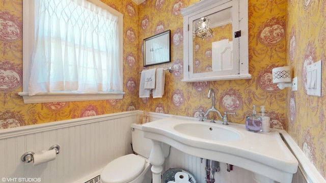 1215 Heather Ln, Glenview, IL 60025 - bathroom with wallpapered walls, healthy amount of natural light, toilet, and a wainscoted wall