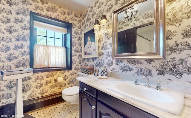 1215 Heather Ln, Glenview, IL 60025 - bathroom featuring toilet, wallpapered walls, vanity, and baseboards