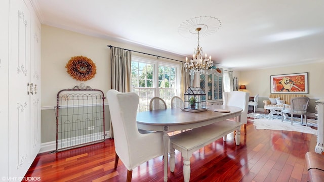 1215 Heather Ln, Glenview, IL 60025 - dining area with a chandelier, wood finished floors, and baseboards