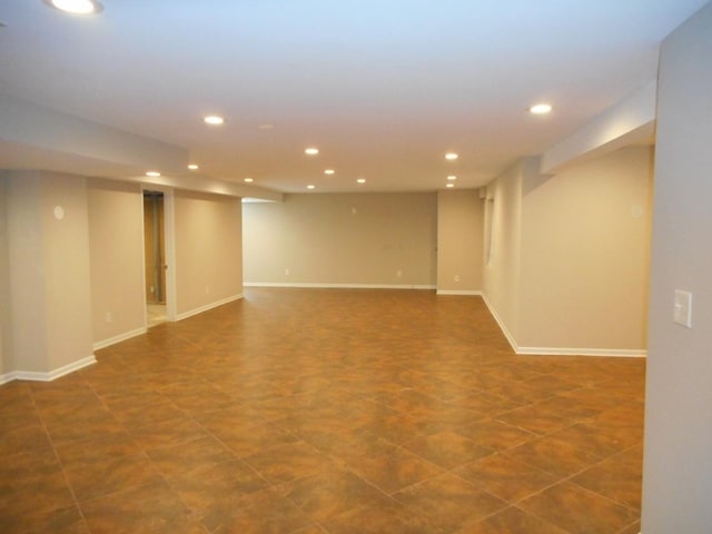 finished basement with recessed lighting and baseboards