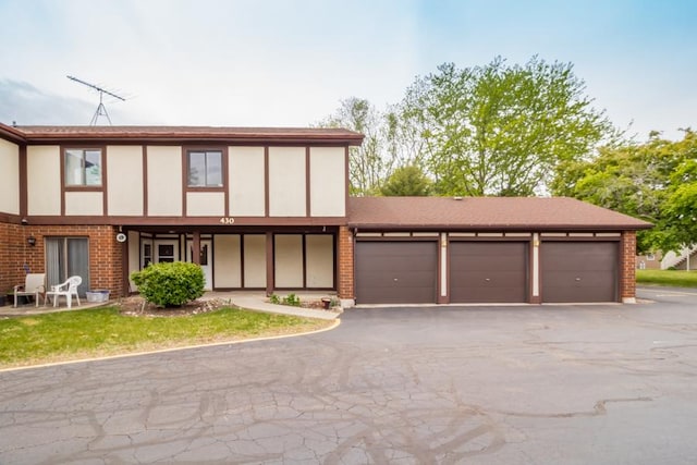 430 Brandy Dr Unit C, Crystal Lake, IL 60014 - view of front facade featuring brick siding and asphalt driveway