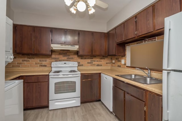 430 Brandy Dr Unit C, Crystal Lake, IL 60014 - kitchen with white appliances, under cabinet range hood, a sink, light countertops, and decorative backsplash