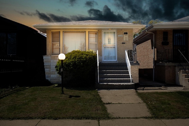 doorway to property with brick siding