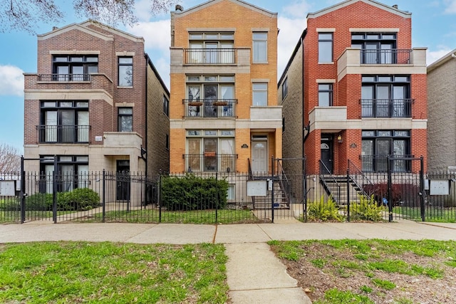 1107 S Independence Blvd Unit 1, Chicago, IL 60624 - multi unit property featuring brick siding and a fenced front yard