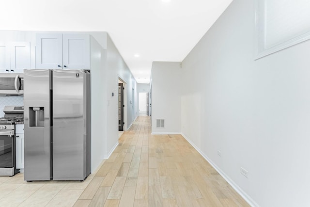 1107 S Independence Blvd Unit 1, Chicago, IL 60624 - hallway with light wood finished floors, baseboards, and recessed lighting