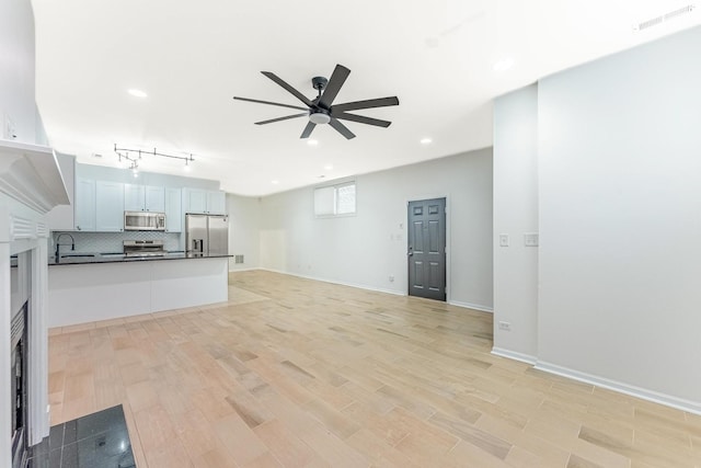 1107 S Independence Blvd Unit 1, Chicago, IL 60624 - unfurnished living room with ceiling fan, light wood finished floors, recessed lighting, and baseboards