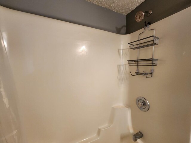 3115 Ingalls Ave Unit 3D, Joliet, IL 60435 - bathroom view of bathtub / shower combination and a textured ceiling