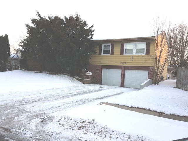 2187 Walnut Ave, Hanover Park, IL 60133 - view of front of property with an attached garage and brick siding