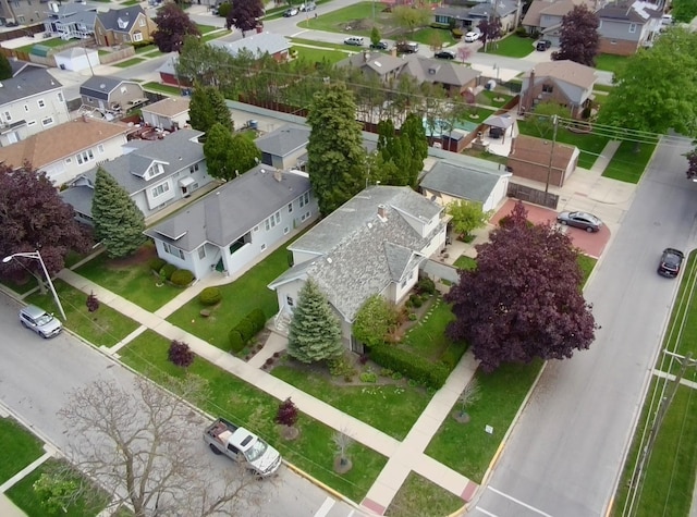aerial view of property and surrounding area with nearby suburban area