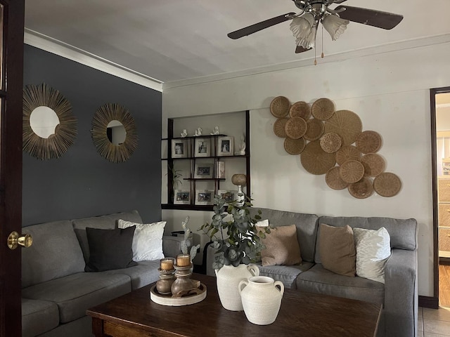 living room featuring ornamental molding and a ceiling fan