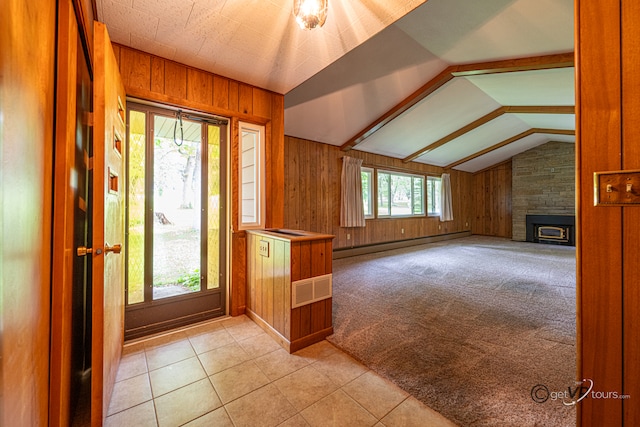 3760 Business 20th Rd, Freeport, IL 61032 - foyer with wood walls, vaulted ceiling, baseboard heating, light tile patterned flooring, and a large fireplace