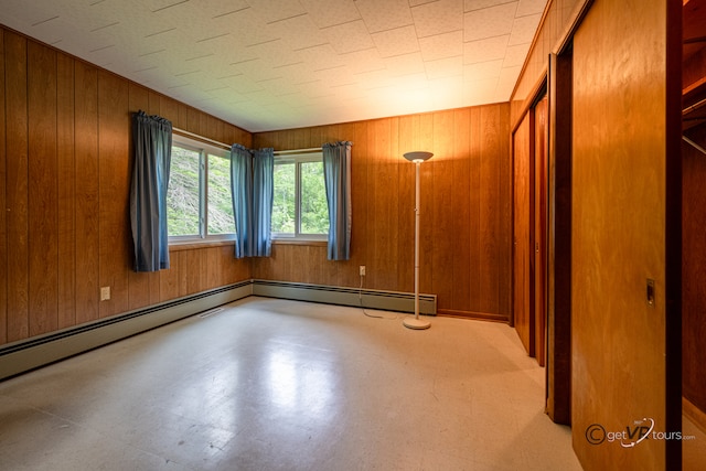 3760 Business 20th Rd, Freeport, IL 61032 - empty room with wooden walls and a baseboard heating unit