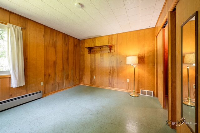 3760 Business 20th Rd, Freeport, IL 61032 - spare room featuring tile patterned floors, wood walls, and baseboard heating