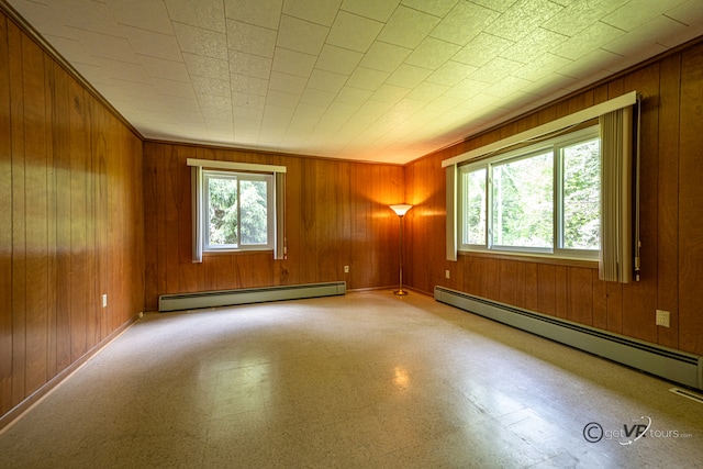 3760 Business 20th Rd, Freeport, IL 61032 - empty room with a baseboard radiator, wood walls, and baseboards