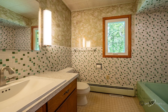 3760 Business 20th Rd, Freeport, IL 61032 - full bathroom featuring a baseboard radiator, toilet, vanity, a bathtub, and tile walls