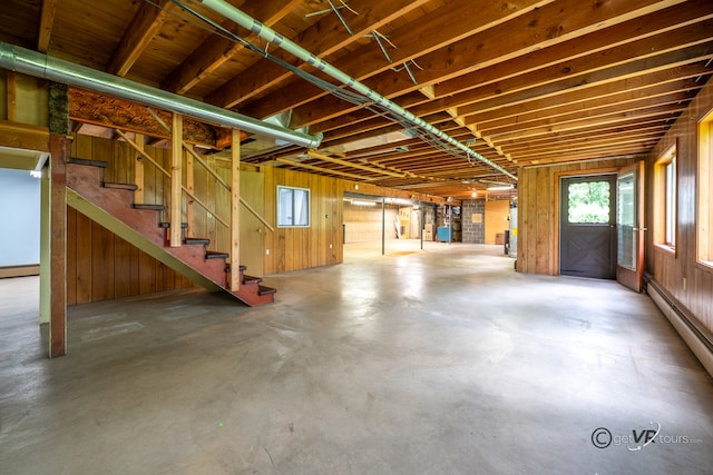 3760 Business 20th Rd, Freeport, IL 61032 - below grade area with a baseboard radiator, stairs, and wood walls