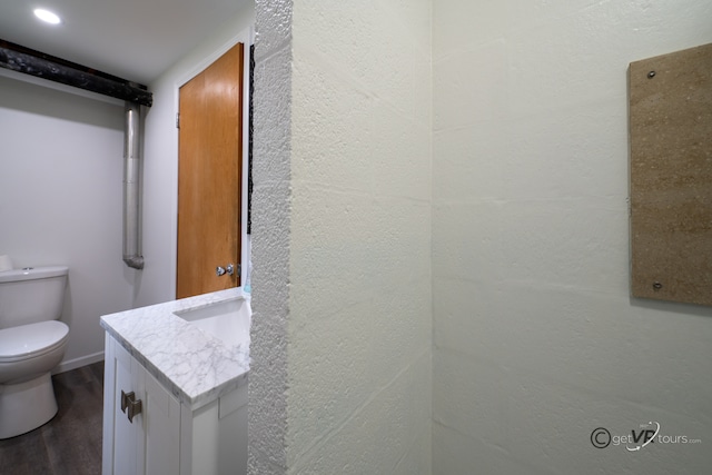 3760 Business 20th Rd, Freeport, IL 61032 - bathroom with vanity, wood finished floors, and toilet