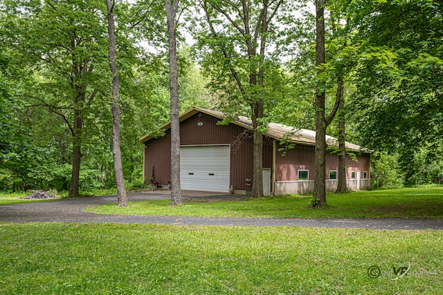 3760 Business 20th Rd, Freeport, IL 61032 - view of front of home with asphalt driveway, an outbuilding, and a front yard