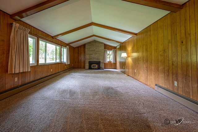 3760 Business 20th Rd, Freeport, IL 61032 - unfurnished living room featuring wooden walls, healthy amount of natural light, a baseboard radiator, and carpet flooring