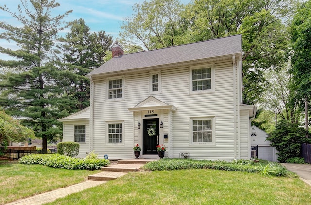 115 S Calumet Ave, Aurora, IL 60506 - colonial home featuring a chimney
