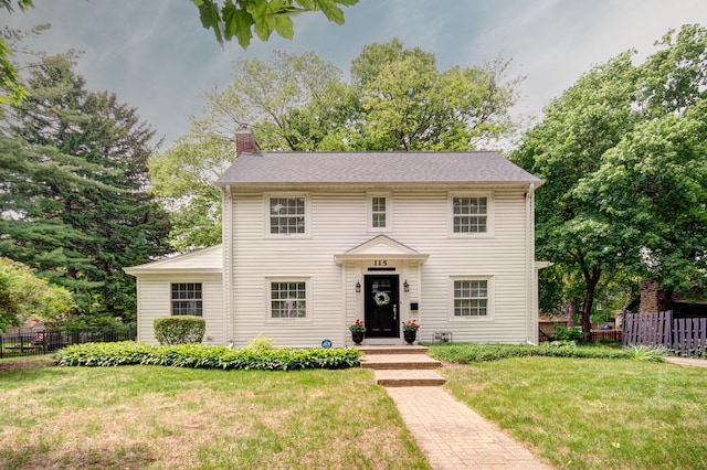 115 S Calumet Ave, Aurora, IL 60506 - colonial inspired home featuring a chimney