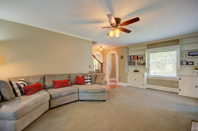 115 S Calumet Ave, Aurora, IL 60506 - living room with arched walkways, carpet floors, baseboards, ceiling fan, and crown molding