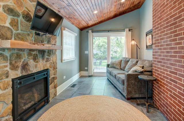 115 S Calumet Ave, Aurora, IL 60506 - living area featuring wood ceiling, vaulted ceiling, a stone fireplace, baseboards, and recessed lighting