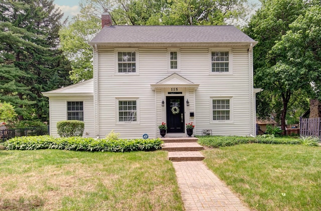 115 S Calumet Ave, Aurora, IL 60506 - colonial inspired home featuring a chimney