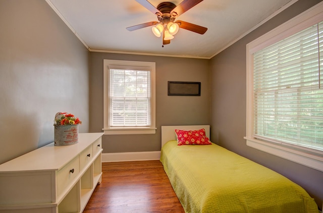 115 S Calumet Ave, Aurora, IL 60506 - bedroom with crown molding, wood finished floors, multiple windows, baseboards, and ceiling fan