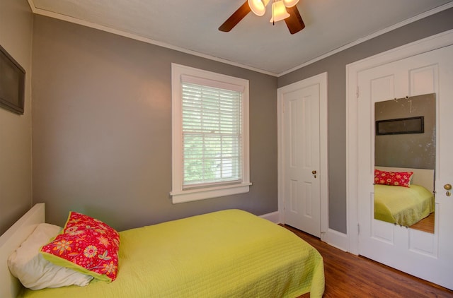 115 S Calumet Ave, Aurora, IL 60506 - bedroom with wood finished floors, crown molding, ceiling fan, and baseboards