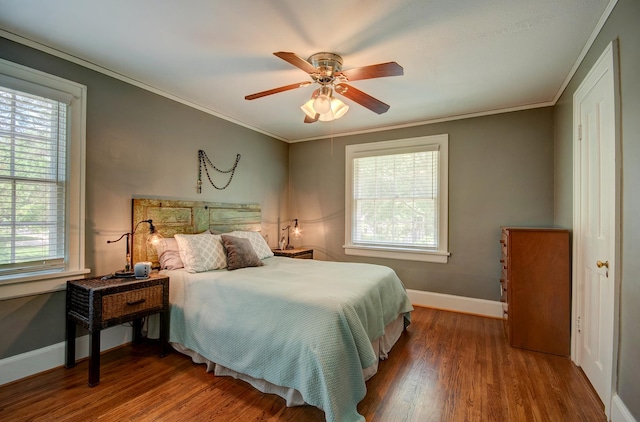 115 S Calumet Ave, Aurora, IL 60506 - bedroom with multiple windows, baseboards, wood finished floors, crown molding, and ceiling fan