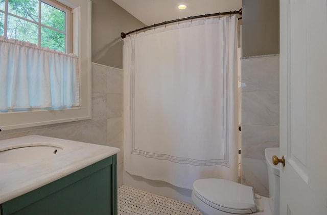 115 S Calumet Ave, Aurora, IL 60506 - bathroom with tile walls, vanity, toilet, shower / bathtub combination with curtain, and recessed lighting
