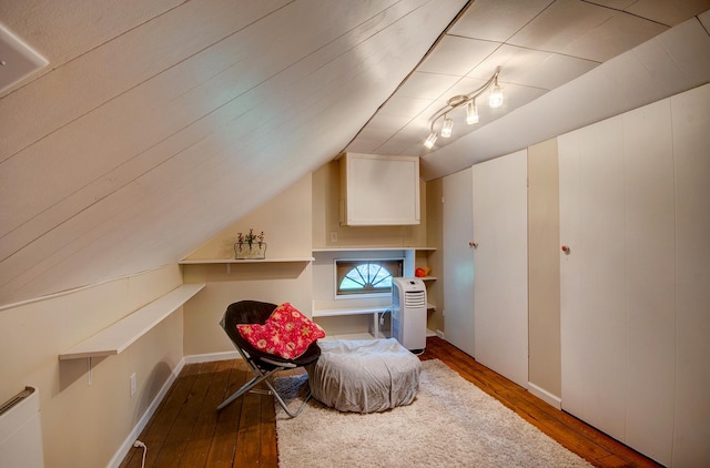 115 S Calumet Ave, Aurora, IL 60506 - sitting room featuring hardwood / wood-style flooring, lofted ceiling, radiator heating unit, and baseboards