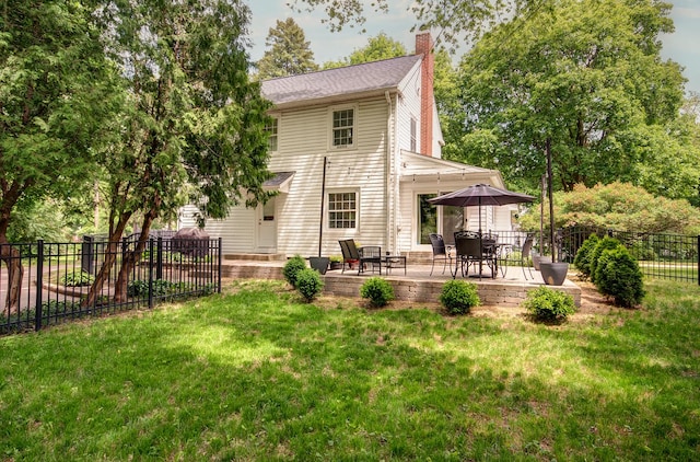 115 S Calumet Ave, Aurora, IL 60506 - back of house with a chimney and a patio area