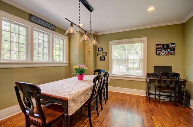 115 S Calumet Ave, Aurora, IL 60506 - dining area featuring ornamental molding, baseboards, wood finished floors, and recessed lighting