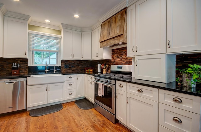 115 S Calumet Ave, Aurora, IL 60506 - kitchen with stainless steel appliances, a sink, white cabinets, ornamental molding, and recessed lighting