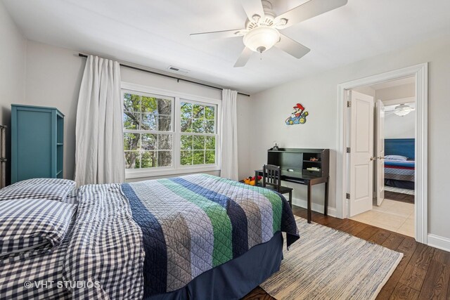 8250 Steepleside Dr, Burr Ridge, IL 60527 - bedroom with hardwood / wood-style flooring, ceiling fan, and baseboards