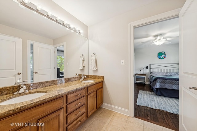 8250 Steepleside Dr, Burr Ridge, IL 60527 - bathroom featuring double vanity, tile patterned floors, baseboards, a ceiling fan, and ensuite bath