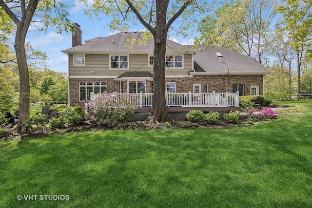 8250 Steepleside Dr, Burr Ridge, IL 60527 - back of property featuring a chimney, a deck, brick siding, and a yard