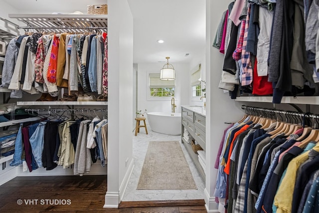 8250 Steepleside Dr, Burr Ridge, IL 60527 - spacious closet featuring wood finished floors and a sink