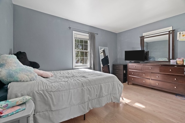 bedroom with light wood-type flooring