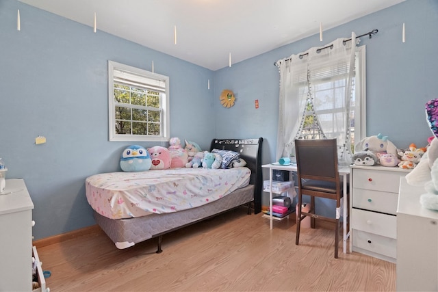 bedroom with wood finished floors