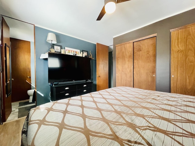 18269 W Woodland Ter, Gurnee, IL 60031 - bedroom featuring multiple closets, ceiling fan, and ornamental molding