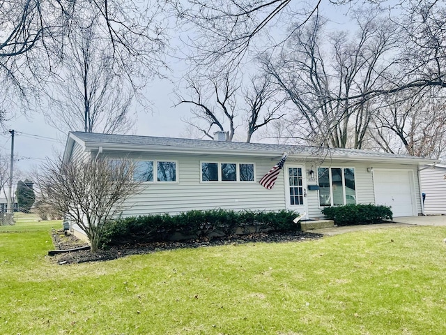 18269 W Woodland Ter, Gurnee, IL 60031 - view of front of home with an attached garage, a front yard, and driveway