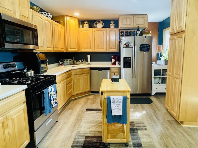 18269 W Woodland Ter, Gurnee, IL 60031 - kitchen featuring appliances with stainless steel finishes, light brown cabinets, light wood-style flooring, light countertops, and recessed lighting