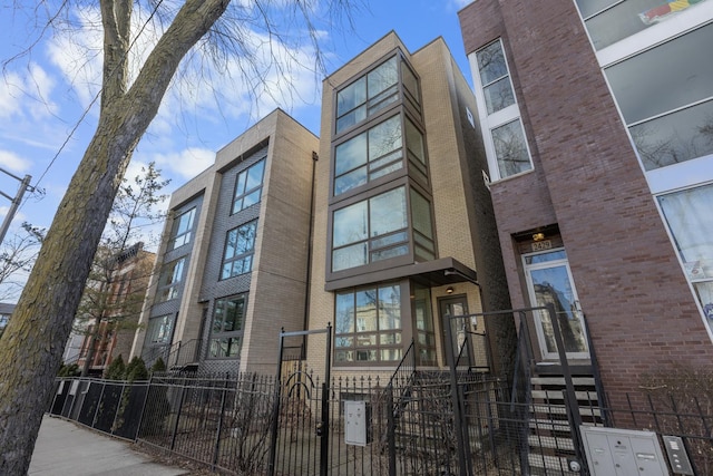 view of building exterior with a fenced front yard